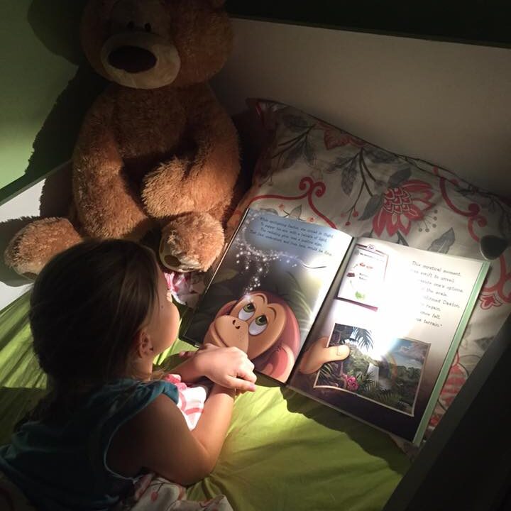 Ariana Reading In Bed